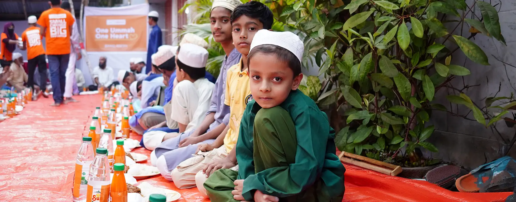 A group of children waiting to break their fast at a community iftar arranged by Penny Appeal.