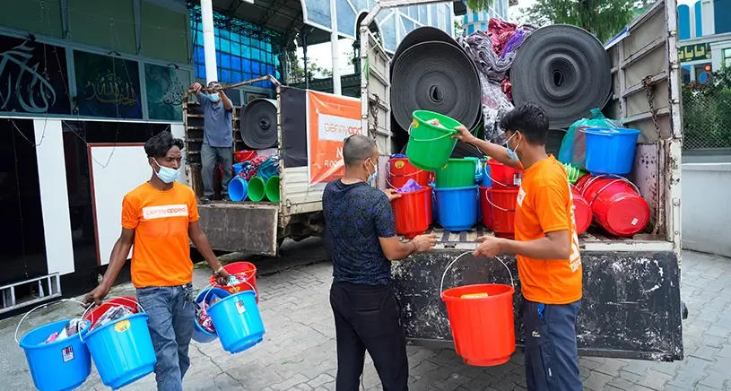 Penny Appeal workers providing buckets of supplies in Nepal.